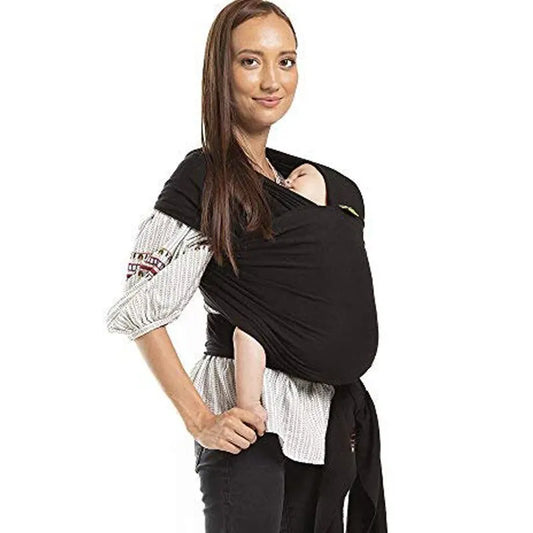 Mother wearing cotton stretch baby wrap carrier holding newborn snugly—hands‑free ergonomic sling UK - colour black