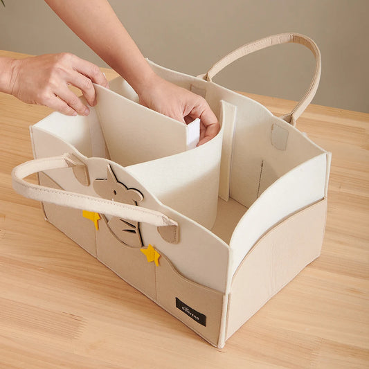 Sunveno diaper caddy on changing table showing compartments for nappies, wipes, creams – portable nursery organiser UK - unicorn
